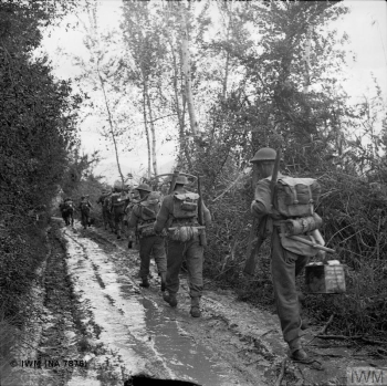 THE CAMPAIGN IN ITALY, SEPTEMBER-DECEMBER 1943: THE ALLIED ADVANCE TO THE GUSTAV LINE (NA 7876) The Volturno River 12 - 16 October 1943: Infantry of the 8th Battalion, Royal Fusiliers advance through the mud in the Volturno area. Copyright: © IWM. Original Source: http://www.iwm.org.uk/collections/item/object/205194441
